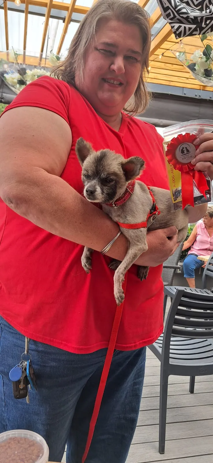 Michelle with Lilly and her award
